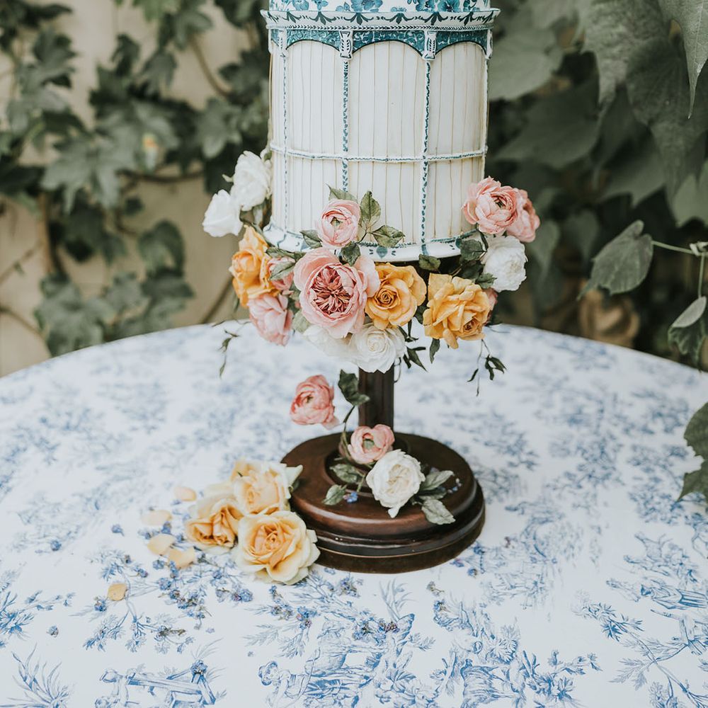 Birdcage wedding dress with pink and orange flowers 