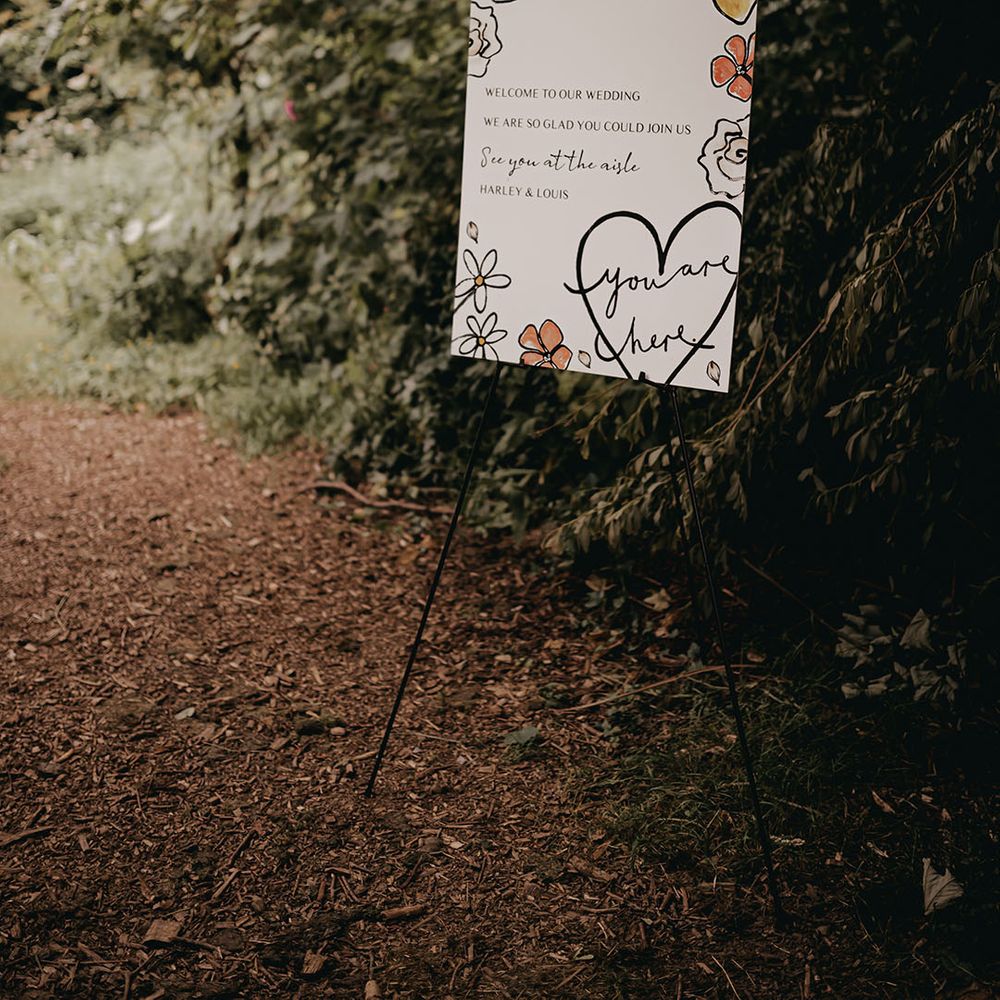 DIY wedding welcome sign on an easel with a flower and lemon pattern