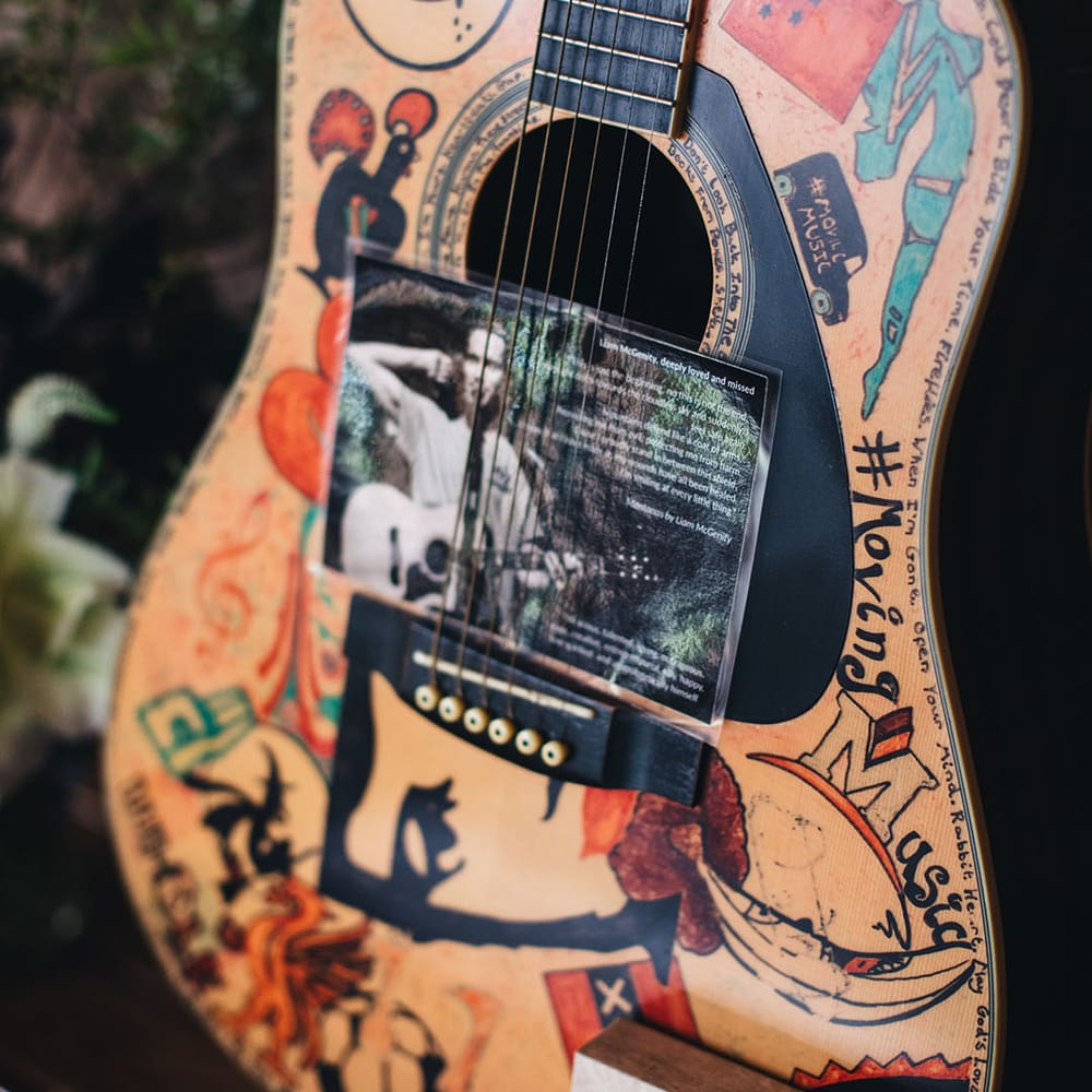 Kate's brother Liam's guitar with personal note honouring his memory 