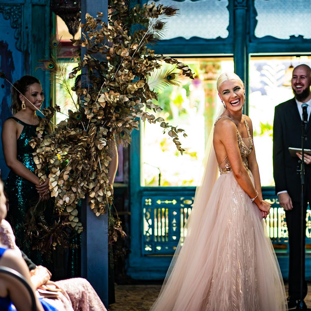Bride laughs during wedding ceremony