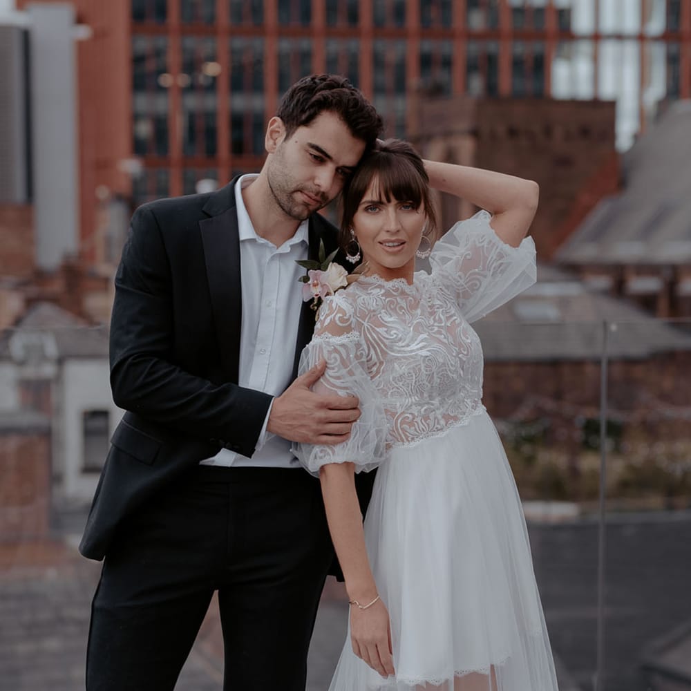 Bride with fringe in a tulle Daniel Chu wedding dress at modern urban jungle Manchester Hall elopement 