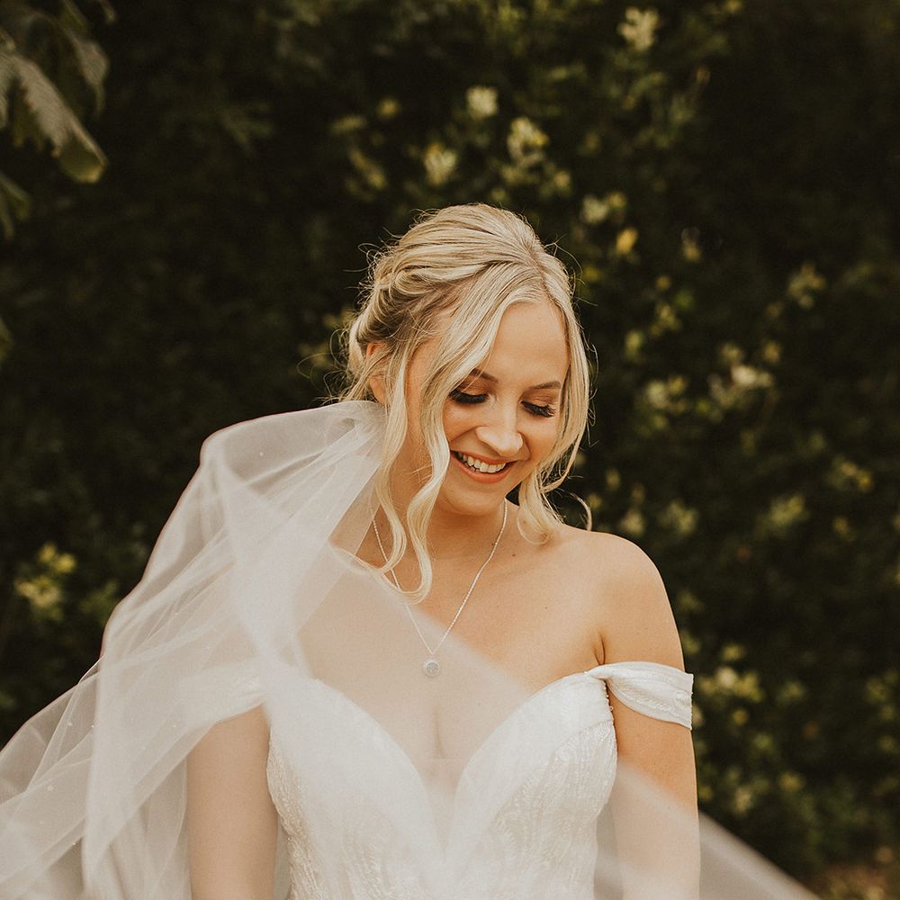 Pronovias wedding dress for bride and veil accessory