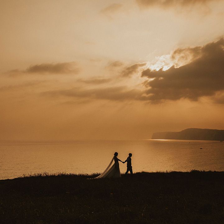 Beautiful sunset shot of bride and groom at Isle of Wight coastal wedding