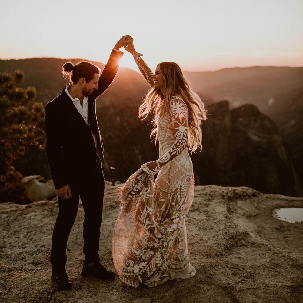 Bride & groom dance on mountain top