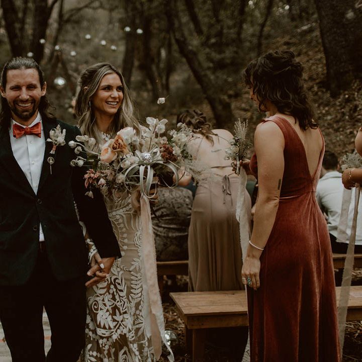 Bride & groom walk down the aisle with one another