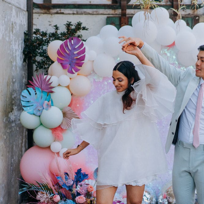 Stylish bride and groom at psychedelic wedding 