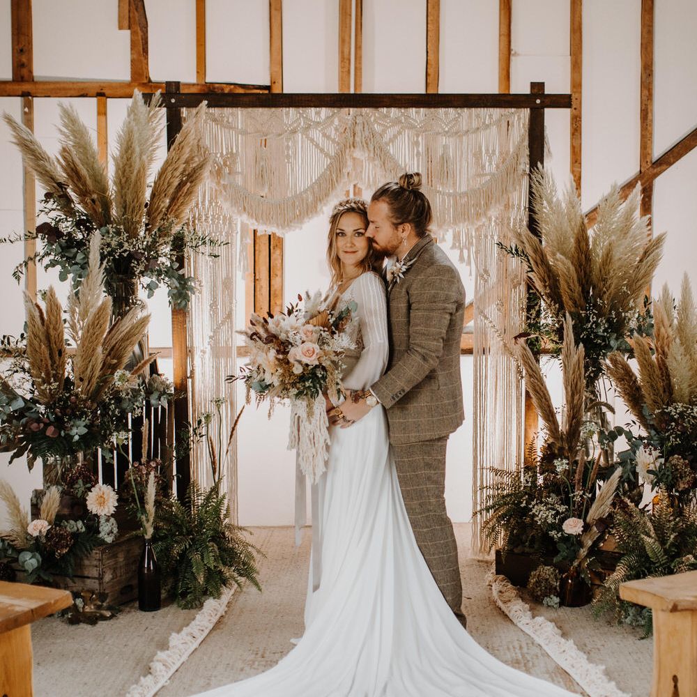 Macrame wedding backdrop for luxe boho barn wedding 