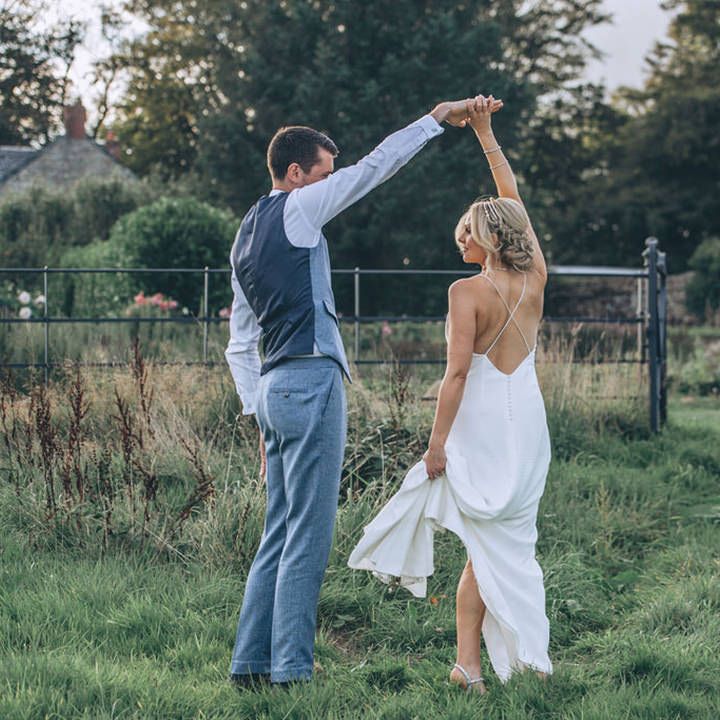 Bride and groom dance in the gardens of Trevenna Barns 