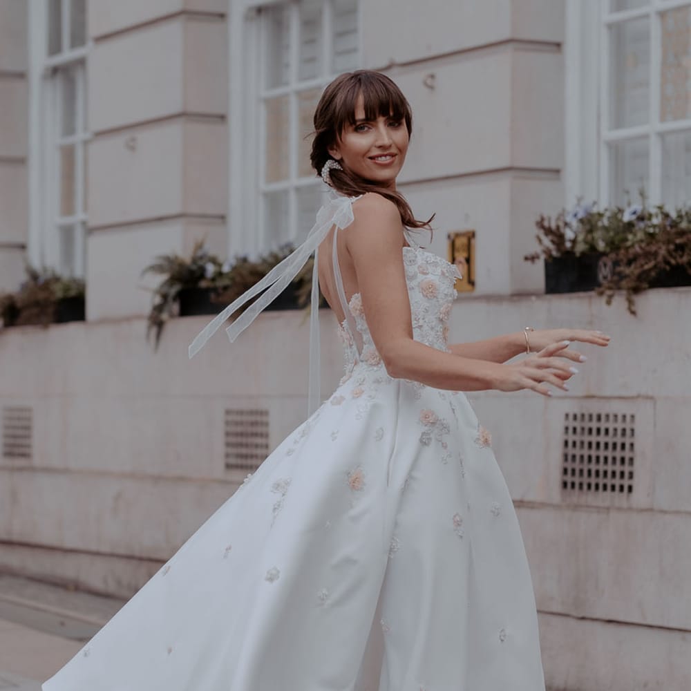 Bride in a Daniel Chu tea length wedding dress with appliqué detail at Manchester elopement 