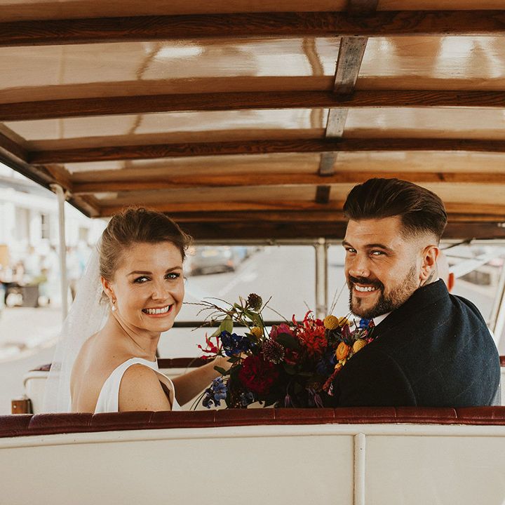 Bride and groom in their Tuc Tuc wedding transport 