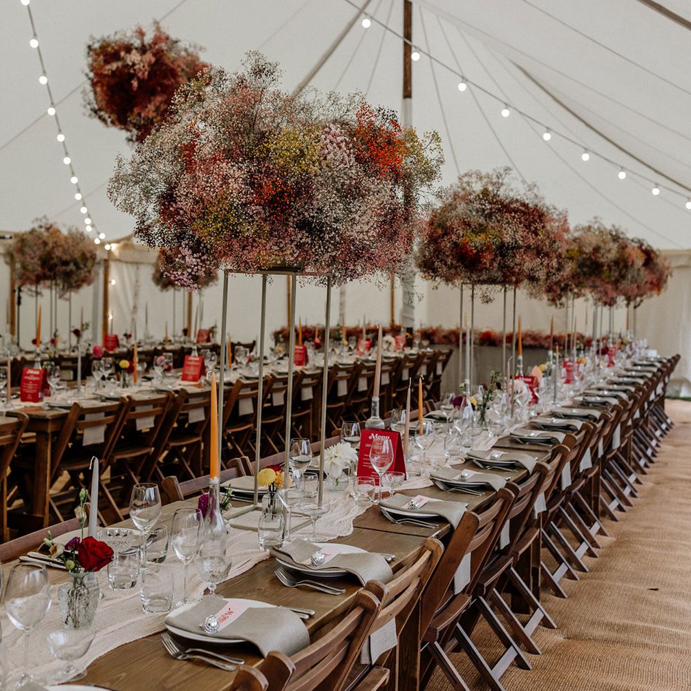 colourful tall centrepiece wedding flowers and gypsophila flower clouds and installations 
