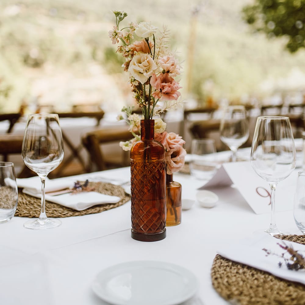 Minimal pink and white flower centrepieces for the tables