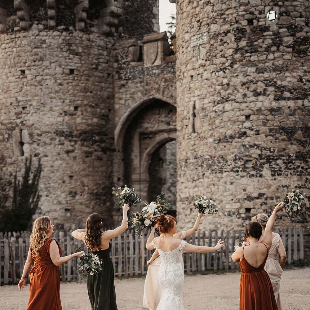 Brides and bridesmaids rock up to the Cooling Castle Barn wedding venue