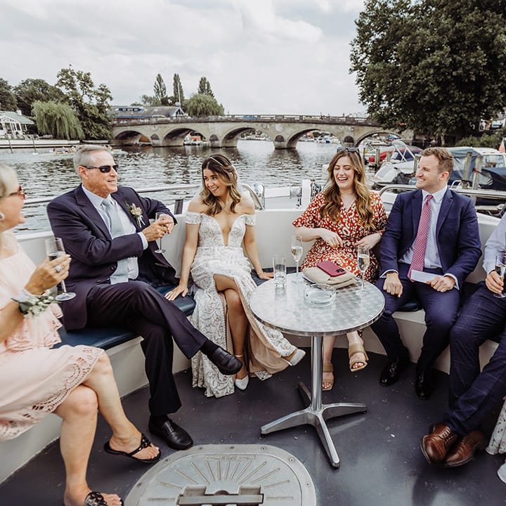 Bride and the wedding guests get to enjoy cocktail hour on a boat ride 