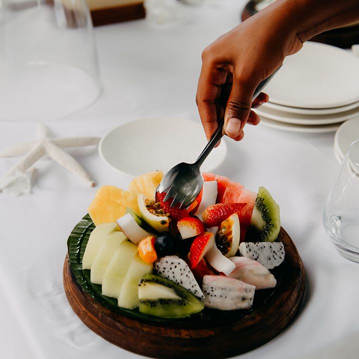 Colourful fruit salad with strawberries, kiwi, passionfruit and star fruit 