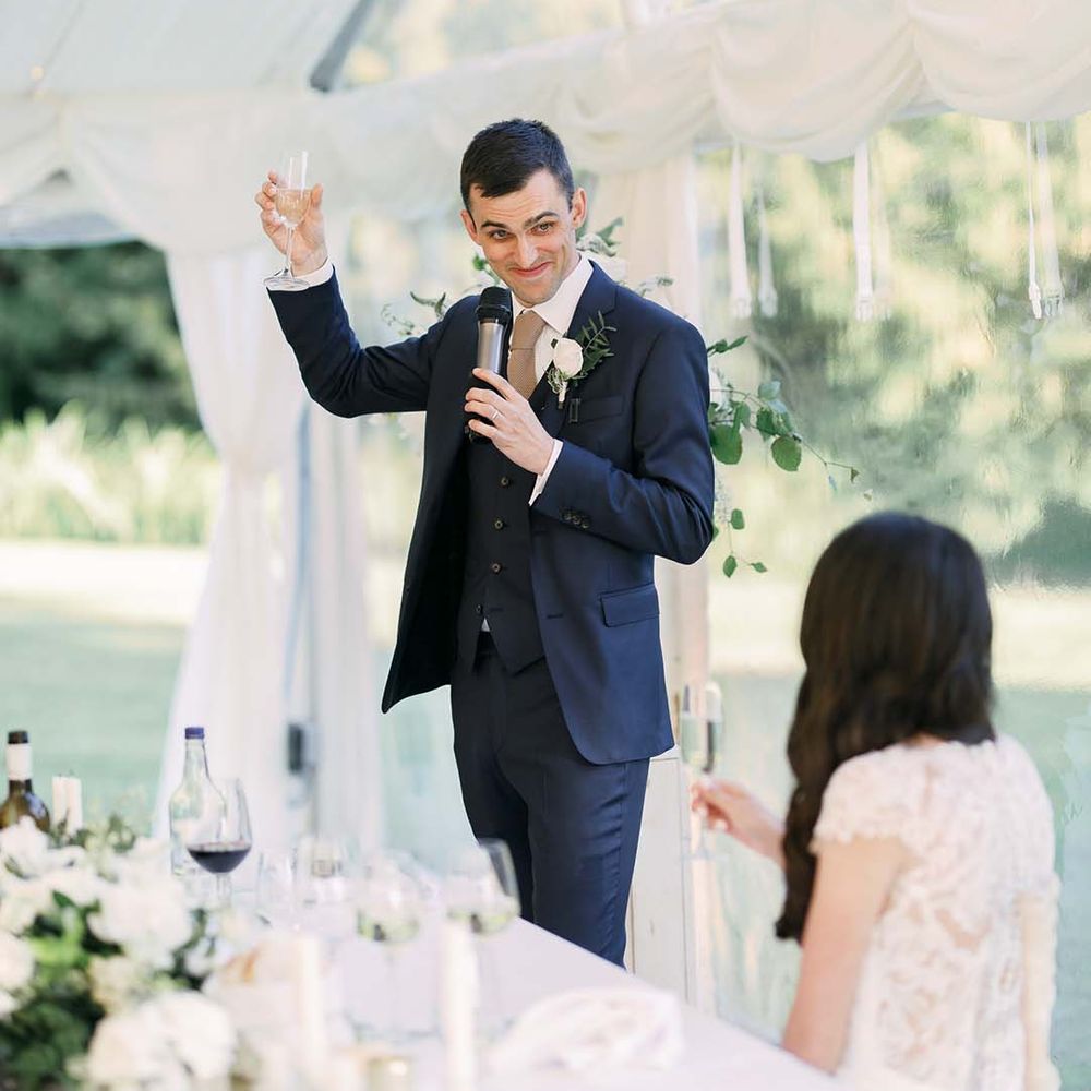 Grooms wedding speech in a navy blue wedding suit 