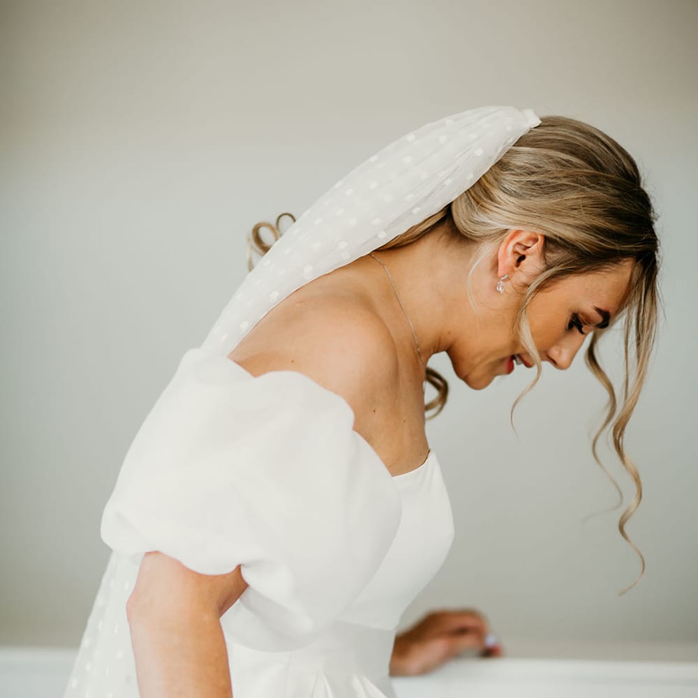 Bride in Jesus Peiro puff sleeve off the shoulder wedding dress with dotted wedding veil 