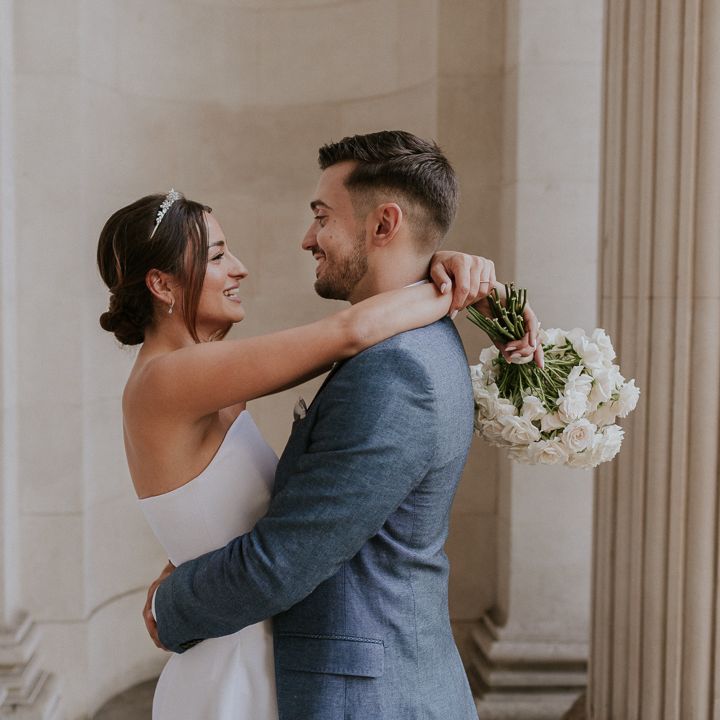 Bride and groom embracing at Old Marylebone Town Hall Wedding 