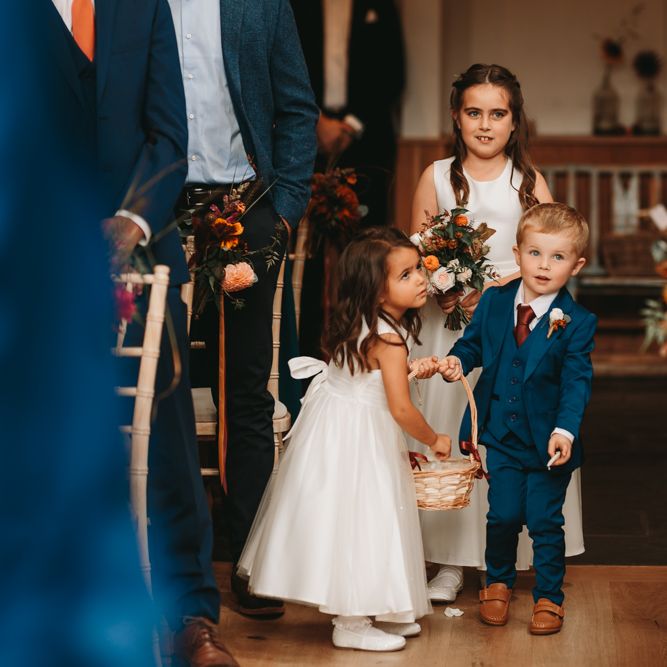 Flower girls and page boys laying petals at Millbridge Court wedding 