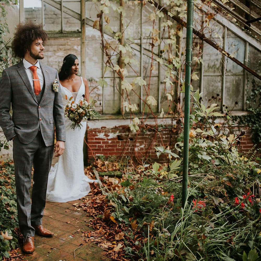 bride and groom portrait in the conservatory at Hooton Pagnell Hall 