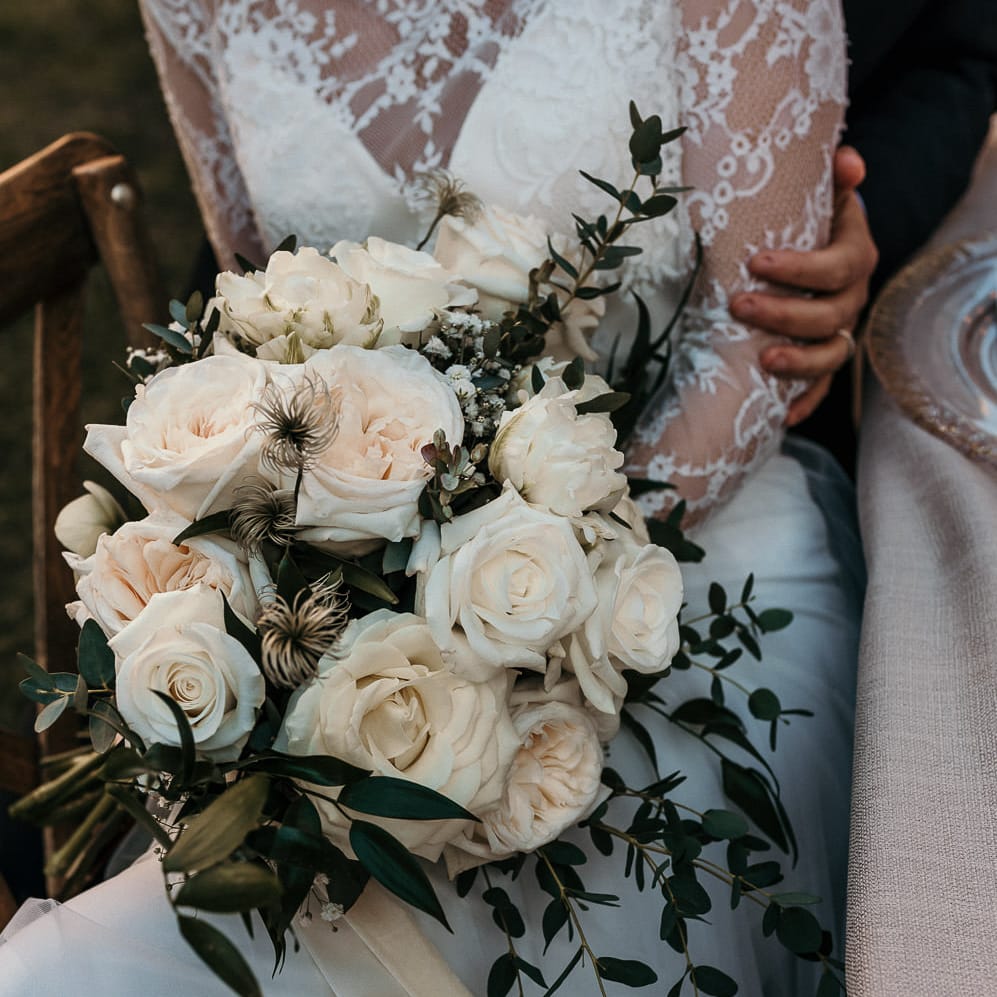 Classic white rose wedding bouquet and foliage 