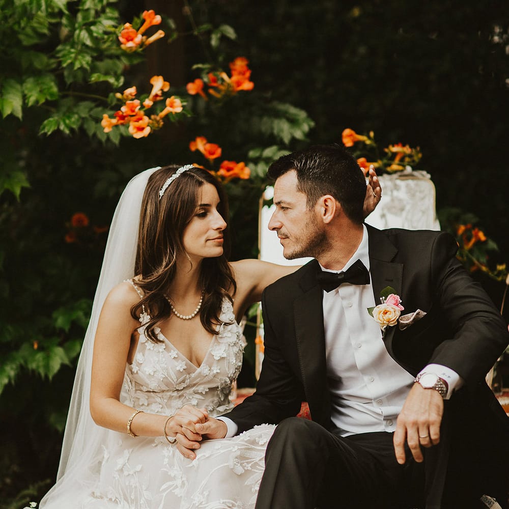 Bride & groom look lovingly at one another on their wedding day
