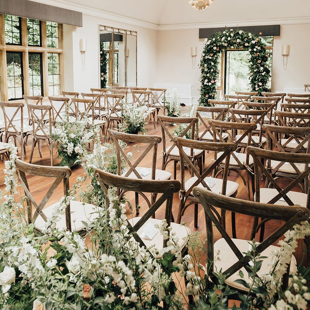 wedding ceremony flowers at Foxhill Manor with green foliage and roses 