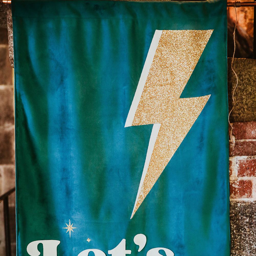 Velvet wedding banner finished with lightening bolt and 'Let's Dance' 