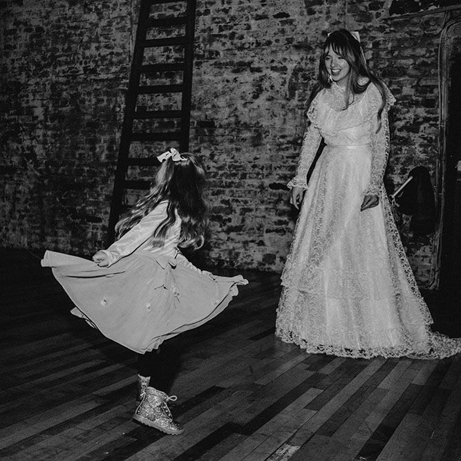Bride dances with little girl at Scale Liverpool during reception 