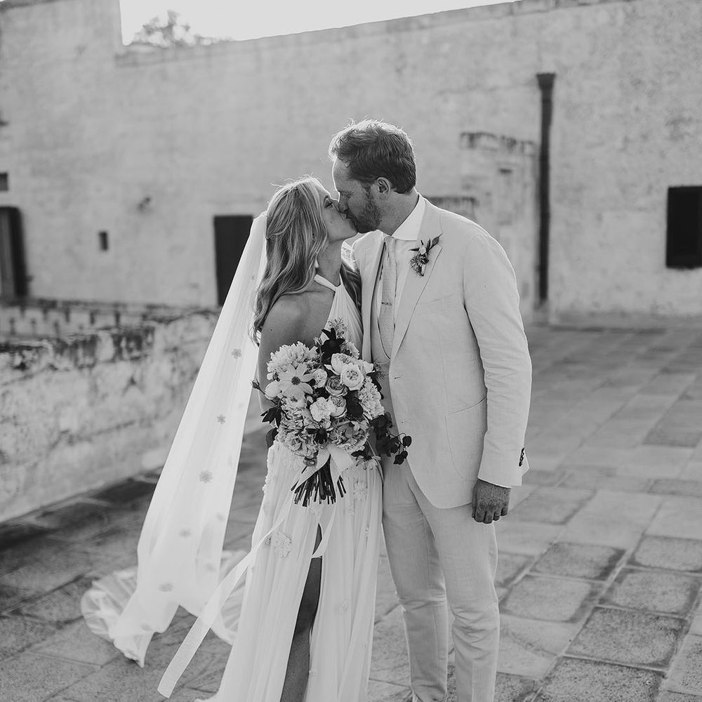 Bride and groom share a kiss for their Italian destination wedding 