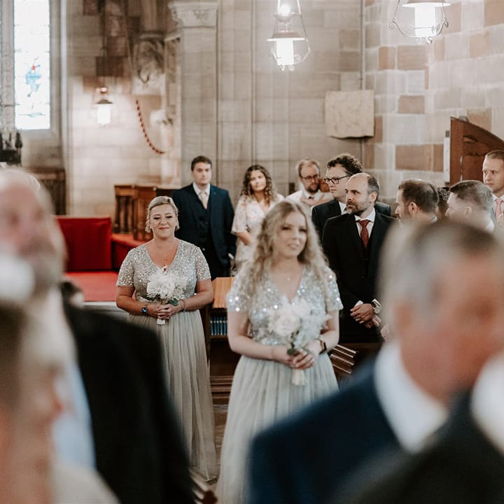 Bridesmaids in pre loved matching sparkly sequin silver dresses 