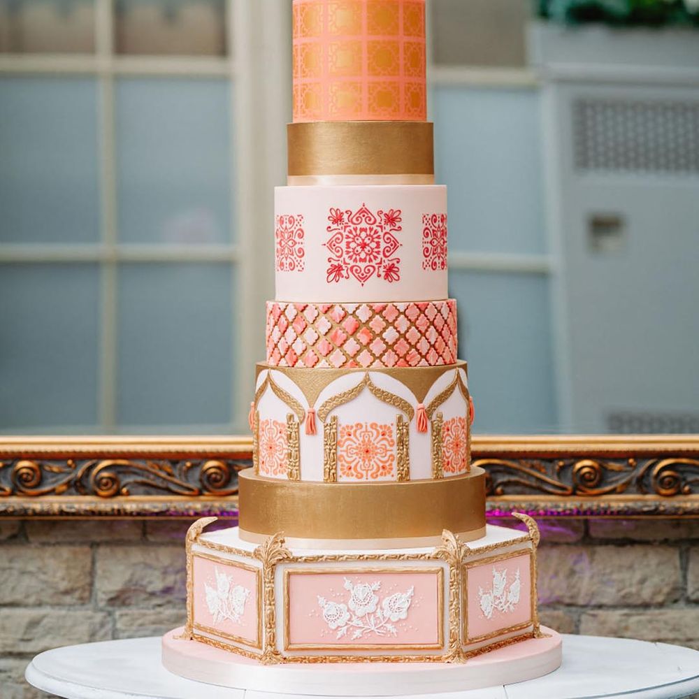 Incredible nine tier wedding cake with Moroccan styling and colours at glasshouse wedding 