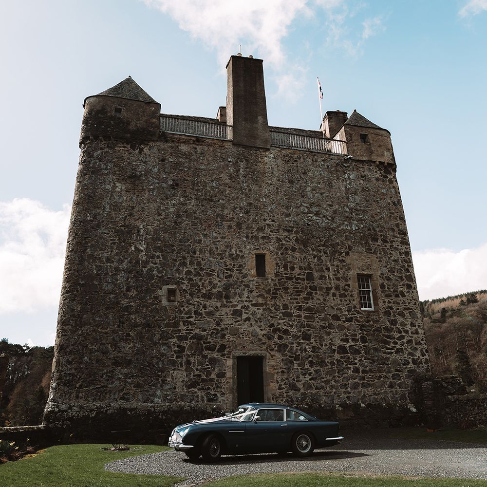 neidpath-castel-scotland-with-blue-car