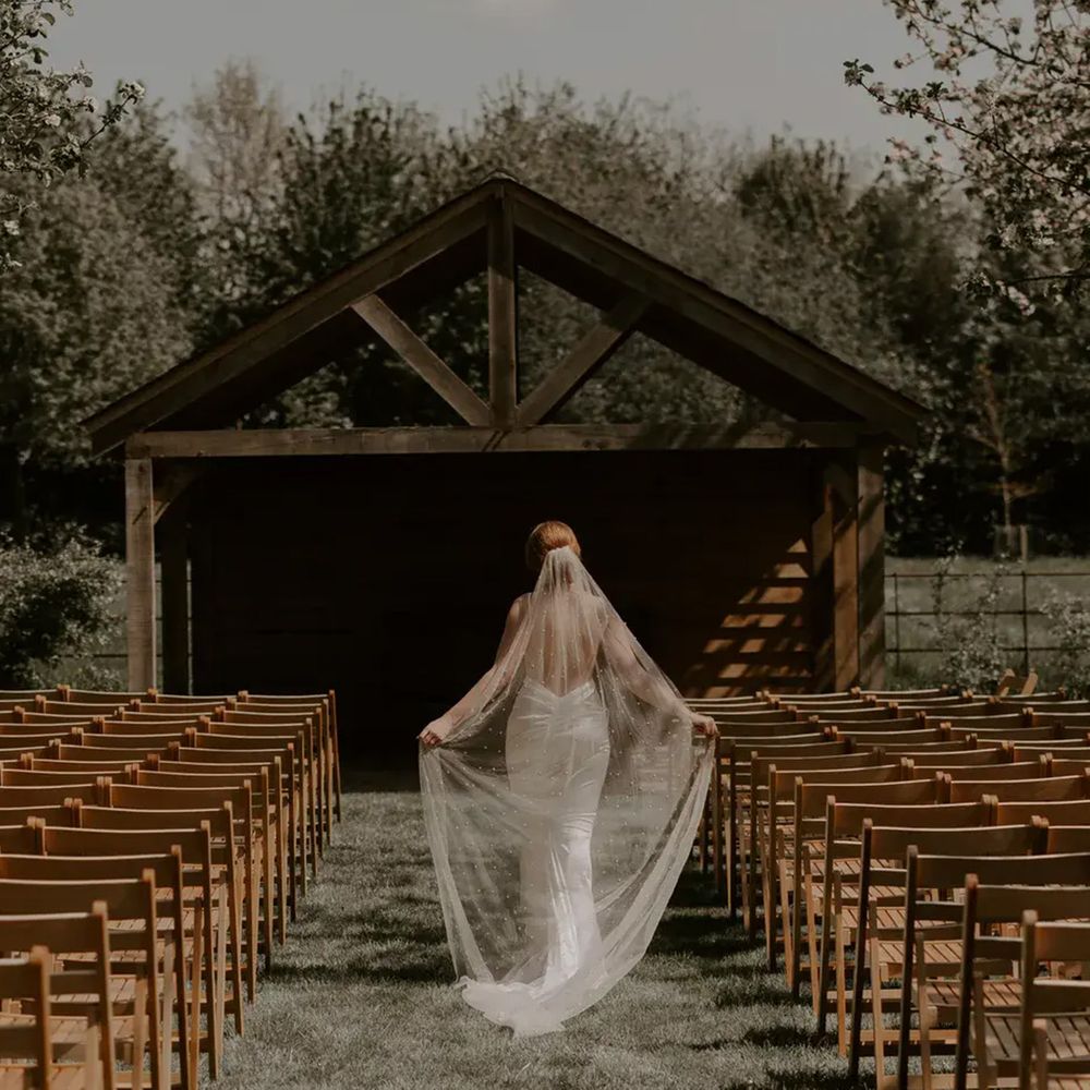 chapel-house-estate-with-bride-walking-at-outdoor-ceremony