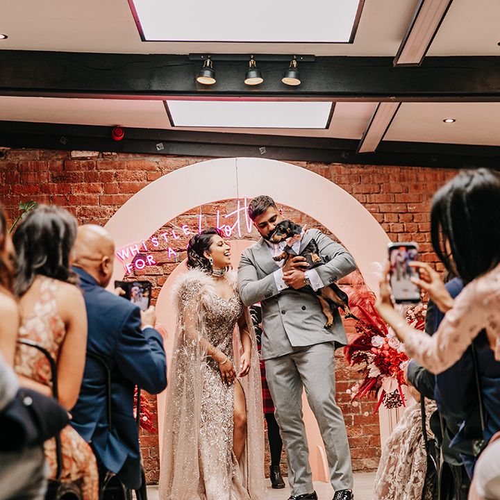 bride-and-groom-walk-back-down-the-aisle-at-wedding