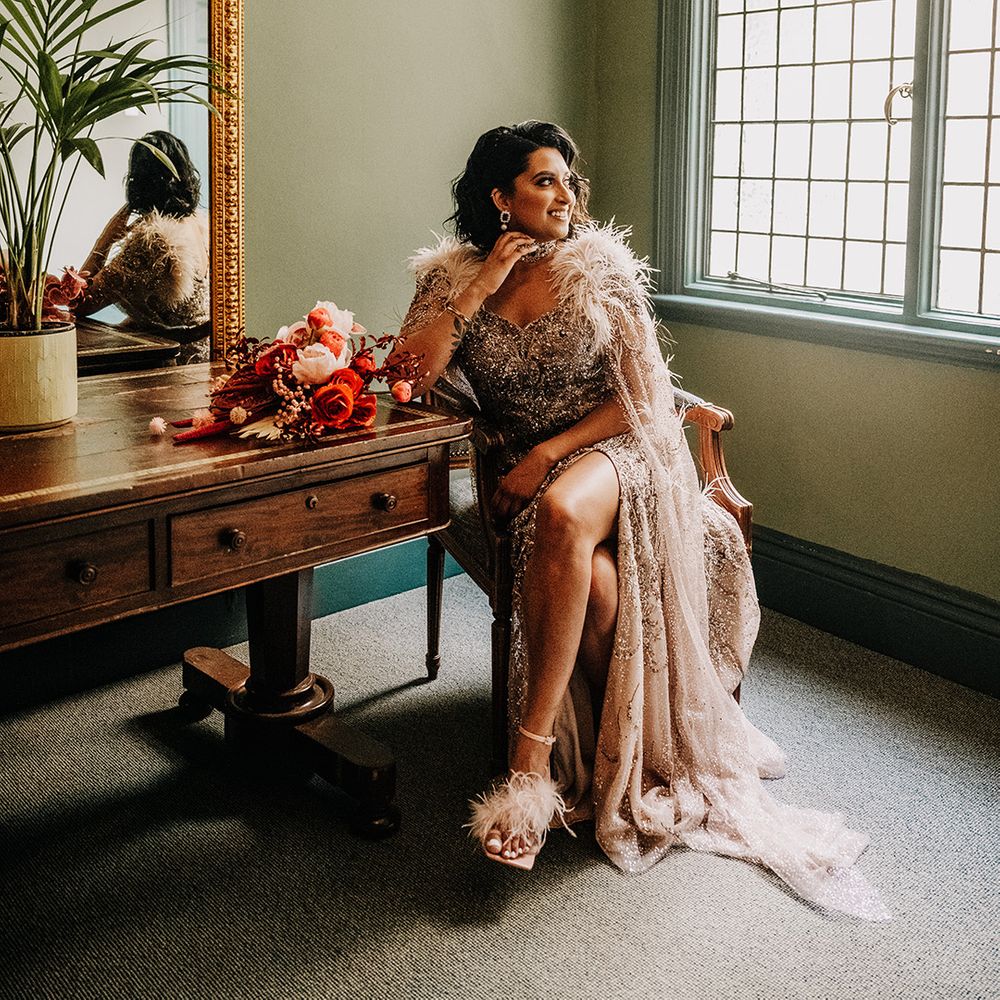 bride-wearing-beaded-feather-wedding-dress