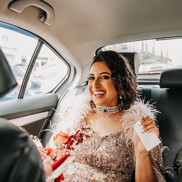 bride-wearing-diamond-statement-choker-necklace-in-wedding-car