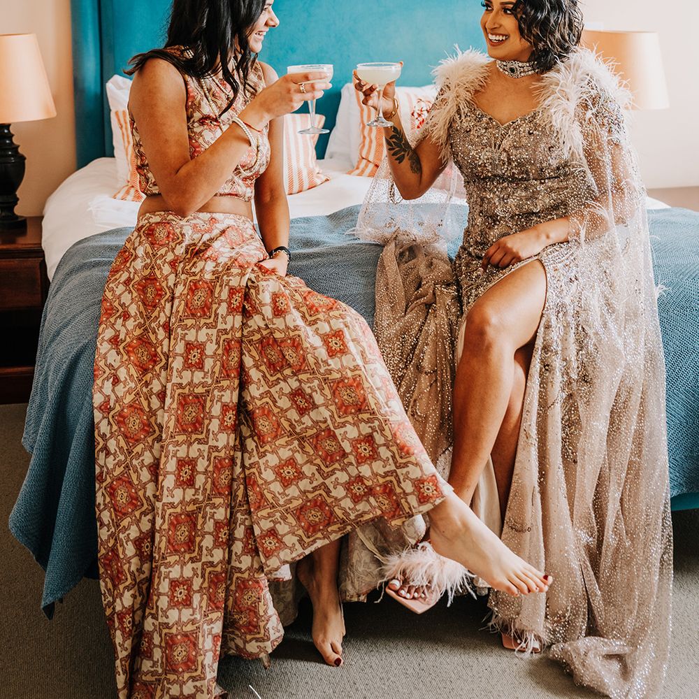 bride-with-bridesmaid-having-wedding-cocktail