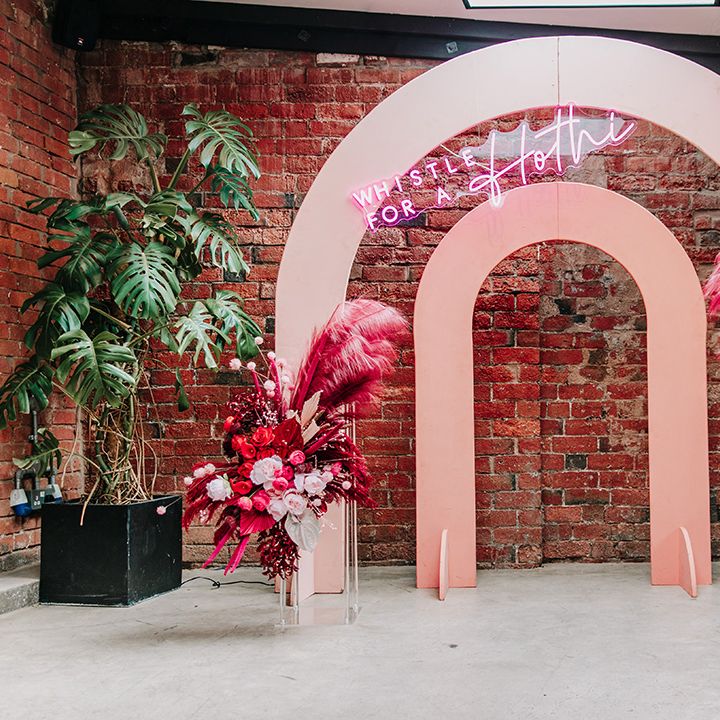 pink-arched-wedding-altar-decor-with-neon-sign-and-dried-flowers