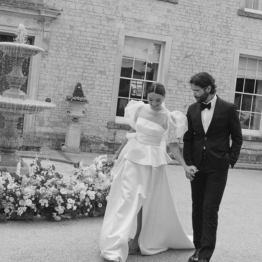 groom-in-black-tux-with-bride-in-puff-sleeve-wedding-dress