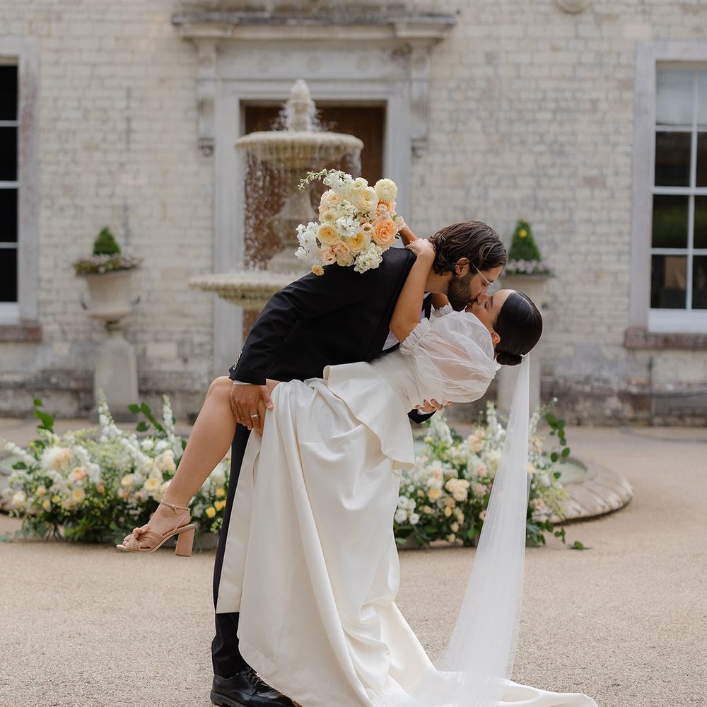 groom-sweeps-bride-in-romantic-kiss-at-ediotiral-shoot