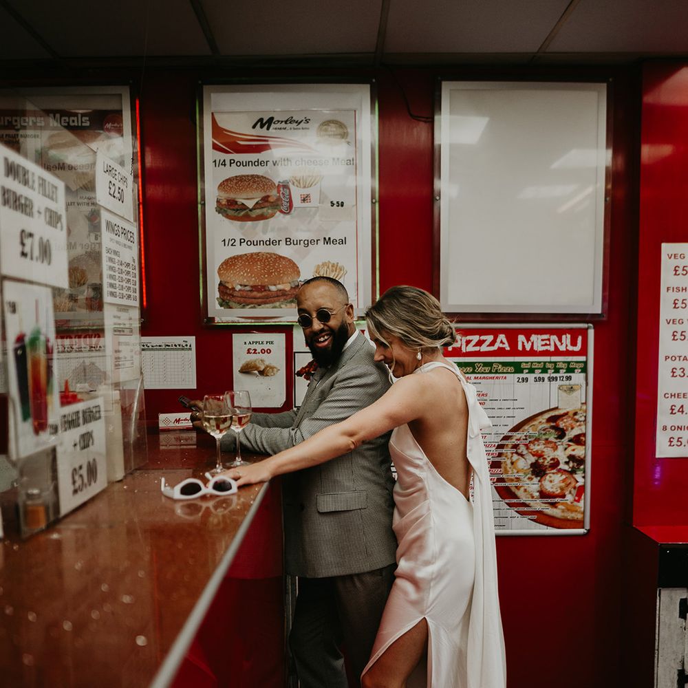 bride-and-groom-ordering-fried-chicken-at-chicken-shop