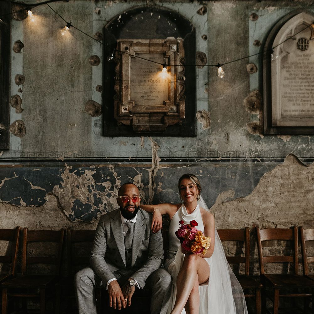bride-and-groom-posing-for-their-couple-portrait-at-city-wedding