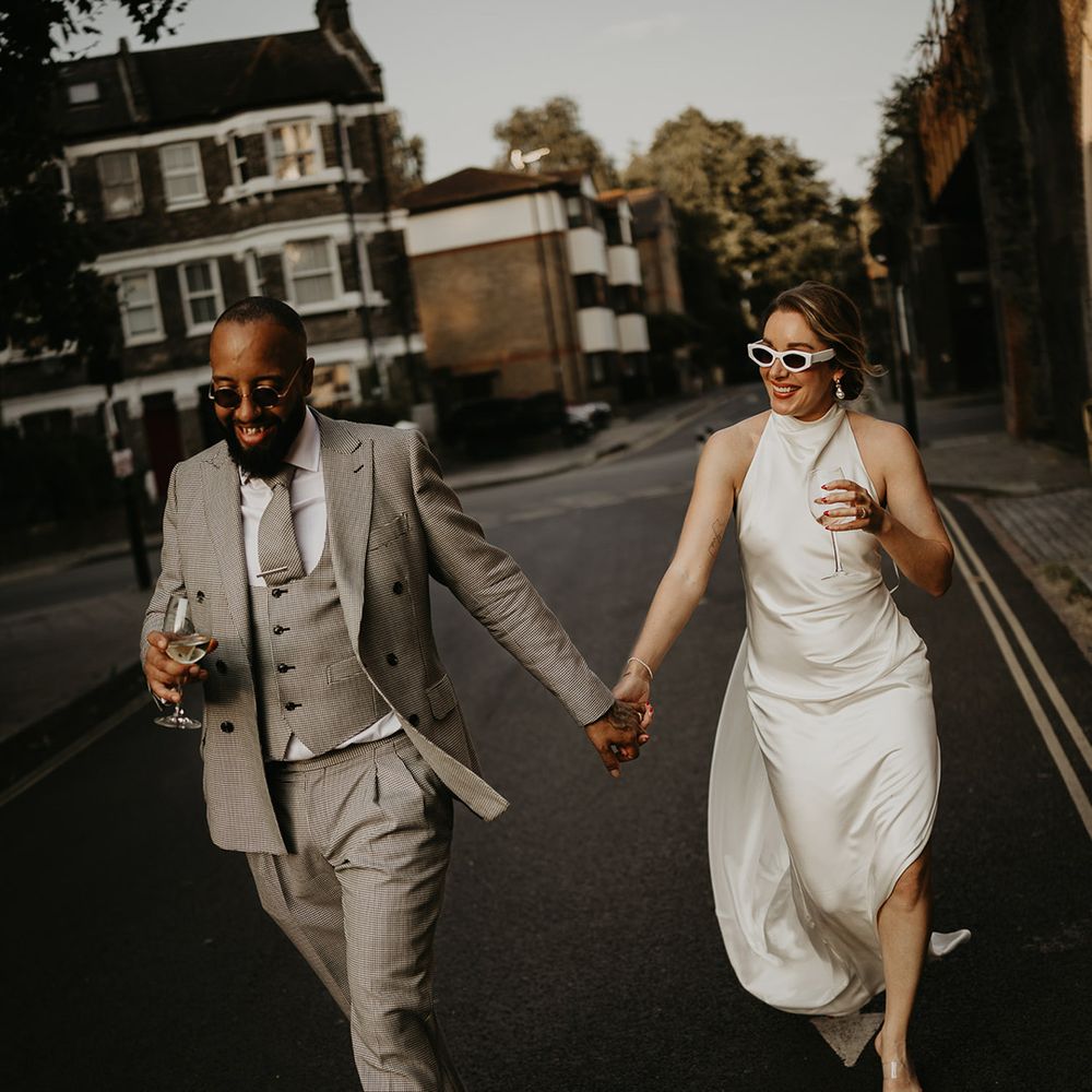 newlyweds-strolling-together-at-city-wedding