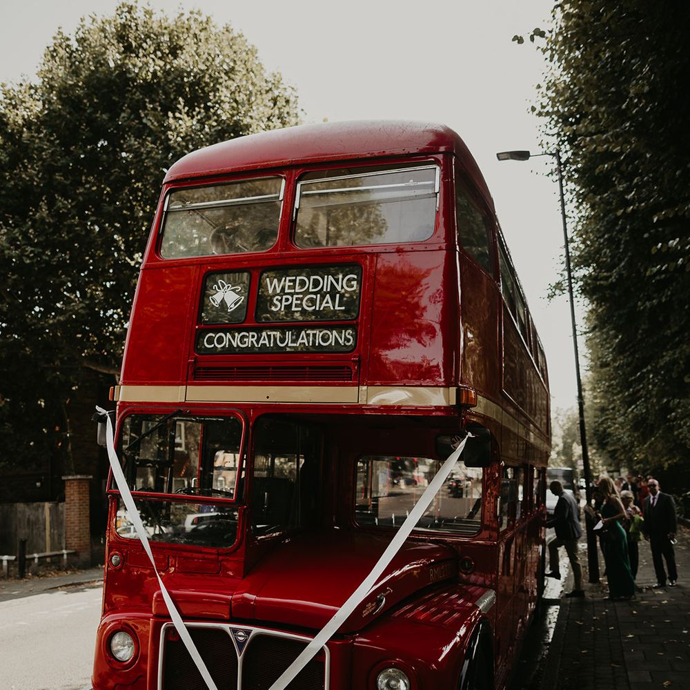red-double-decker-bus-with-white-ribbon