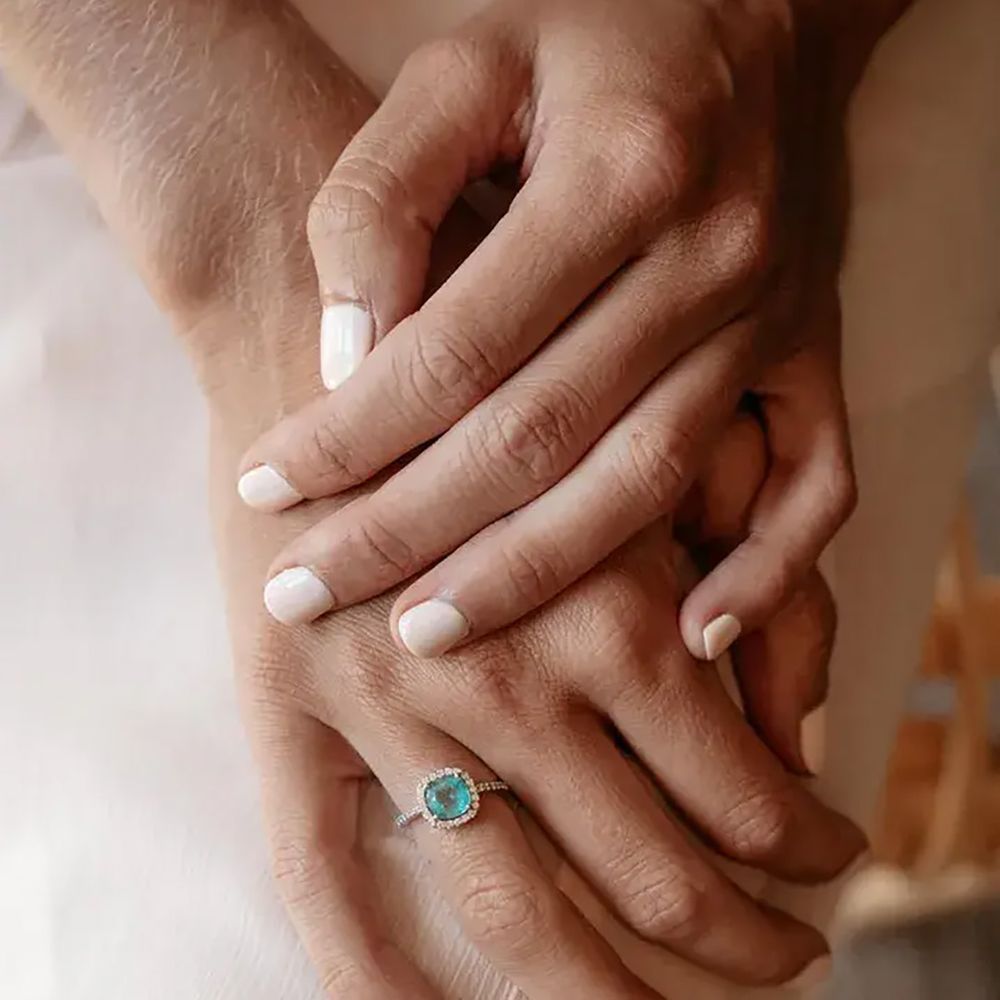 delicate green gemstone engagement ring