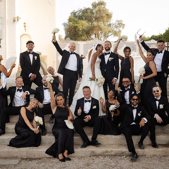 black-tie-wedding-with-black-bridesmaid-dresses-and-tuxedos