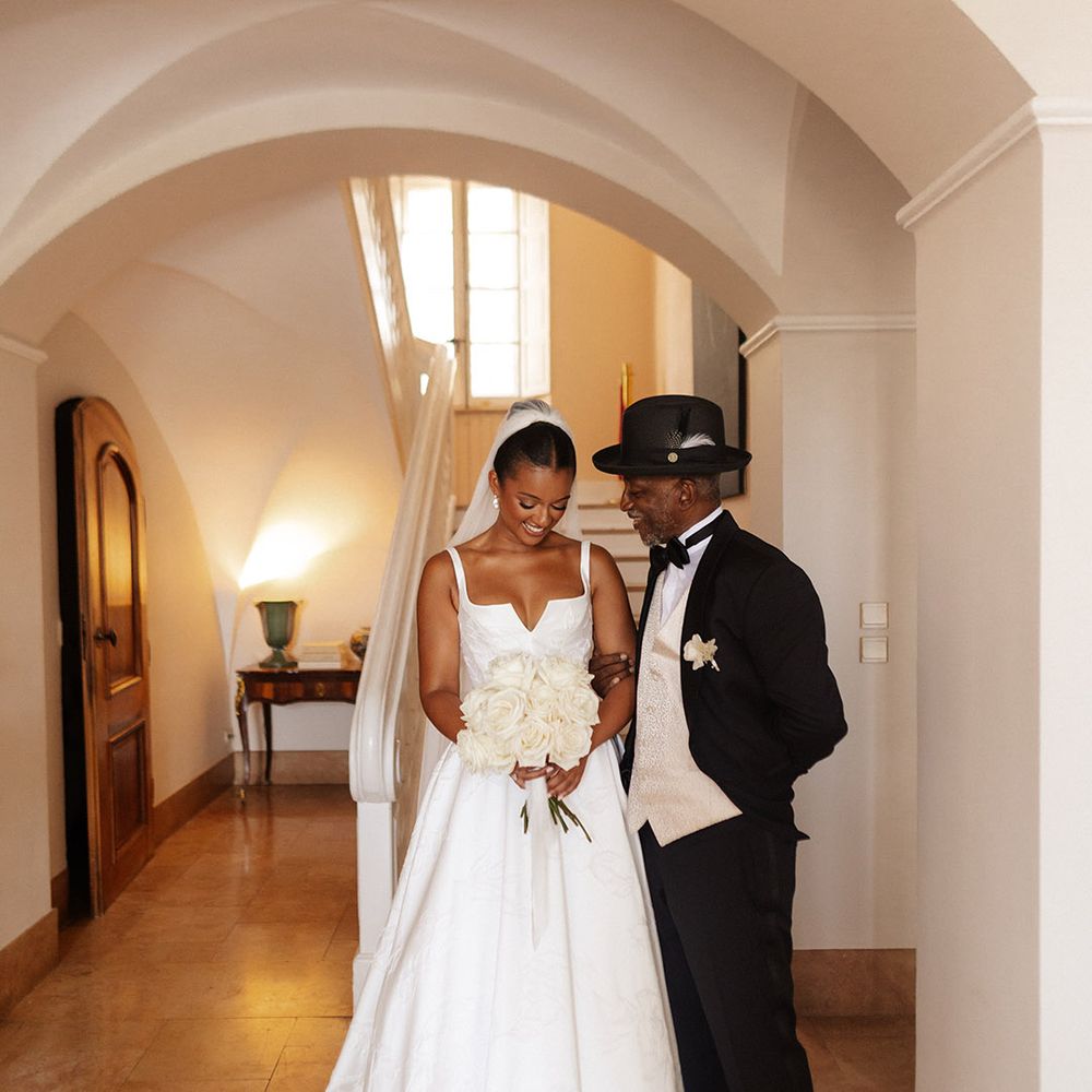 father-of-the-bride-poses-with-bride