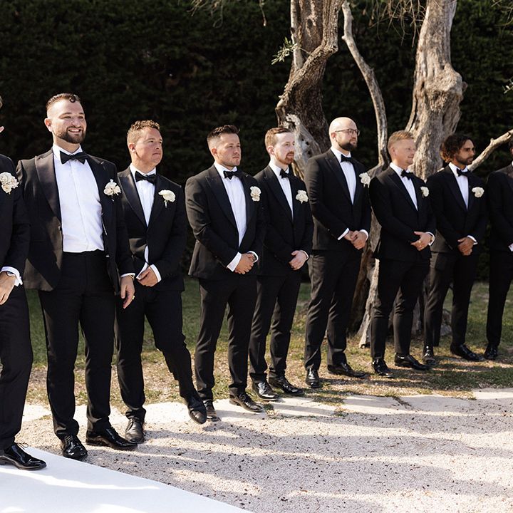 groom-and-groomsmen-at-outdoor-destination-wedding-ceremony