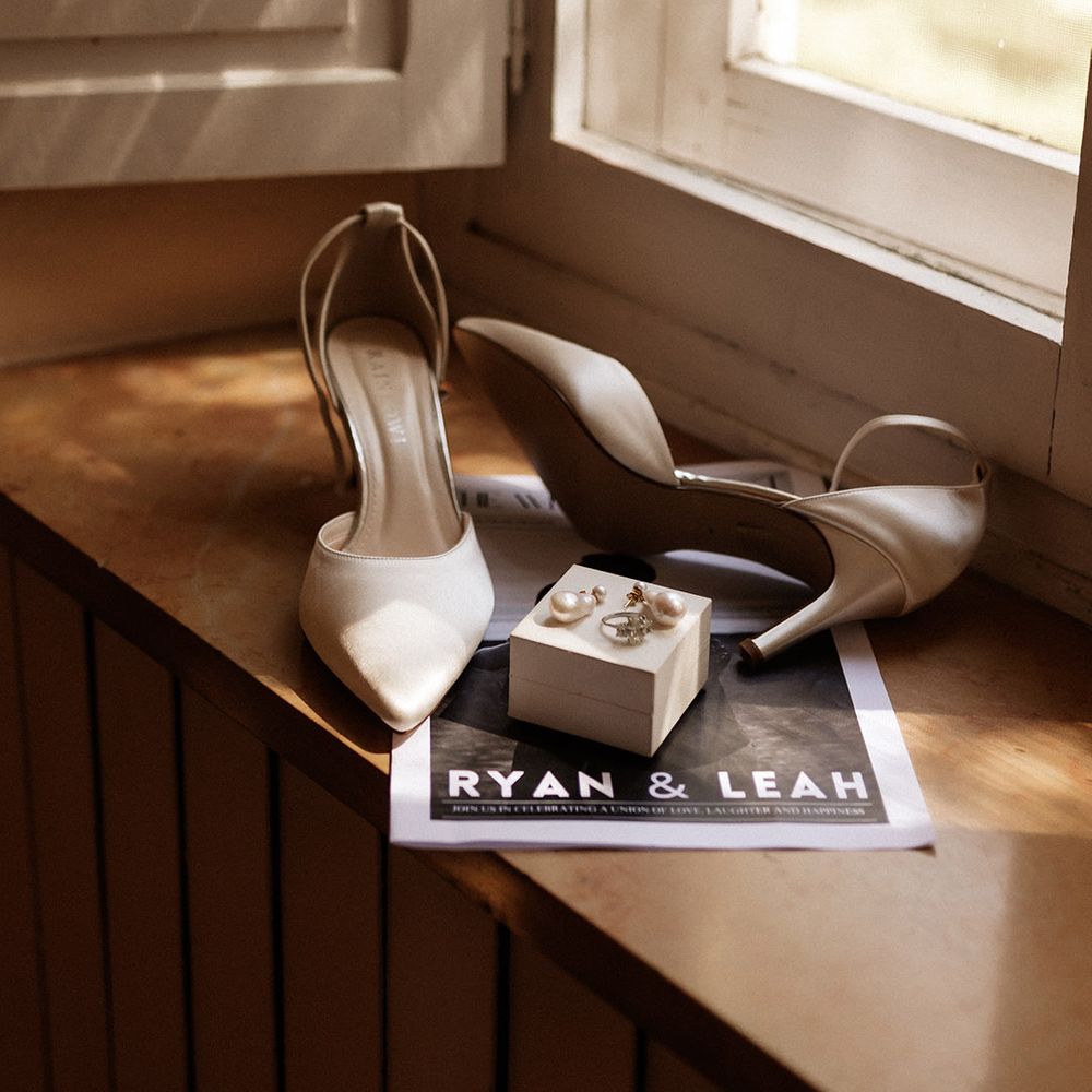 white-rainbow-club-wedding-shoes-and-personalised-newspaper